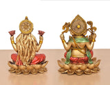 Rear view resin Lakshmi and Ganesh on lotus bases, decorative crowns and halos