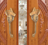 Brass man-face door handle pair with gold finish, sculpted beard and turban heads