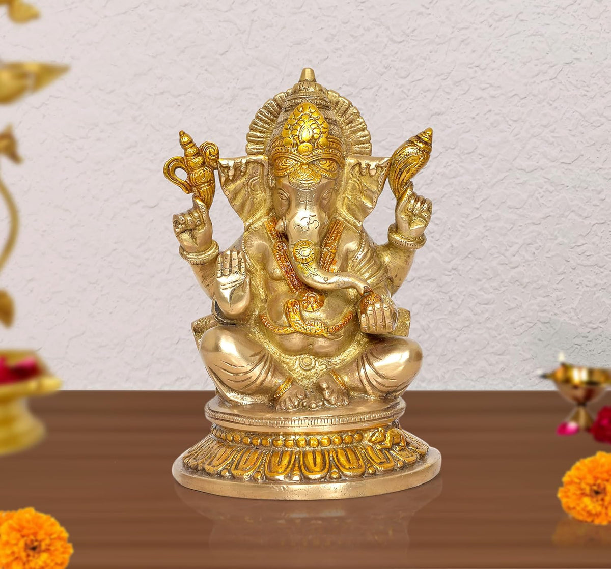 Ganesha idol statue, gold-tone four-armed seated on lotus base