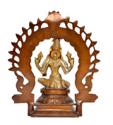Brass Lakshmi idol statue with circular halo, seated goddess and crown details