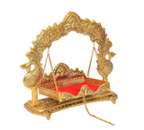 Ornate gold metal swing cradle for Laddu Gopal with red base, decorative pillars and rope