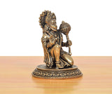 Brass Hanuman JI sculpture seated with detailed draped ornaments and crown on ornate base