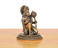 Brass Hanuman JI sculpture seated with detailed draped ornaments and crown on ornate base