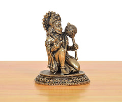 Brass Hanuman JI sculpture seated with detailed draped ornaments and crown on ornate base