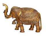 Brass elephant statue with ornate armor-style engravings and dangling bell ornament