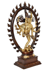 Brass Natraj statue dancing pose, one leg raised; curved halo with spiked ornaments