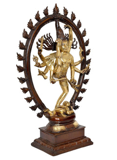 Brass Natraj statue dancing pose, one leg raised; curved halo with spiked ornaments