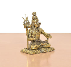 Shiva Aashirwaad Mudra brass figurine, seated profile with tall trident staff