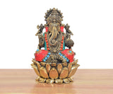 Ganapati Bappa brass idol front view, red and blue ornaments, lotus pedestal