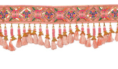 Close-up: pink decorative toran strip with gold and orange bell-like tassels