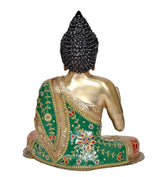 Back/side view Buddha idol: gold back, green draped robe, red-and-gold decorated base.