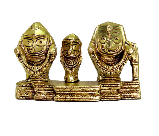 Gold-finish decorative idol: three stylized faces on shared pedestal, detailed engravings