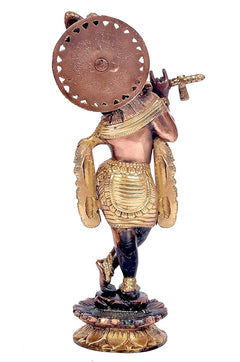 Back view of brass Lord Krishna statue, disc halo and ornate outfit