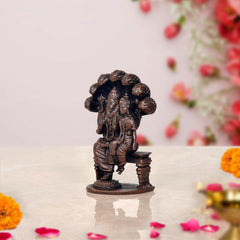 Copper Lakshmi Narasimha statue in profile, ornate seated deity figures with base