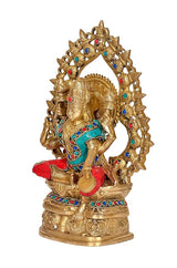 Lakshmi idol seated with raised hands, jeweled frame halo in brass finish