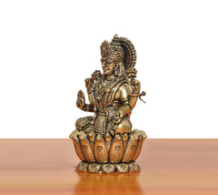 Side view Lakshmi goddess bronze idol, seated on lotus, elaborate crown and arms