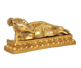 Brass reclining Ganesha on decorative platform base, detailed trunk and ornaments
