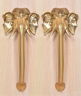 Golden brass Ganesha face door handles, two sets with carved elephant heads and grip bases
