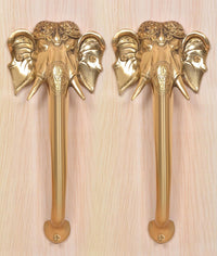 Golden brass Ganesha face door handles, two sets with carved elephant heads and grip bases