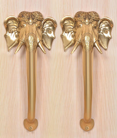 Golden brass Ganesha face door handles, two sets with carved elephant heads and grip bases