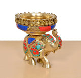 Brass elephant idol with gold urli bowl, multicolor mosaic panels and chain-rim details