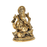 Gold-tone brass Ganesha idol statue, angled view with raised hands and halo