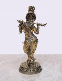 Brass Lord Krishna statue playing flute, rear angle with decorated hair ornament