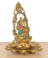 Brass Ganesh diya idol with raised arms, 21 lamp bowls on round base