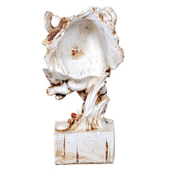 Back view of resin lion head with cub figurine, white surface with brown speckles, base