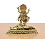 Mahakaali idol rear view, spiked back halo and draped detailing on brass pedestal