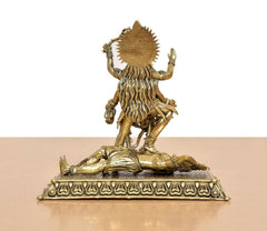 Mahakaali idol rear view, spiked back halo and draped detailing on brass pedestal