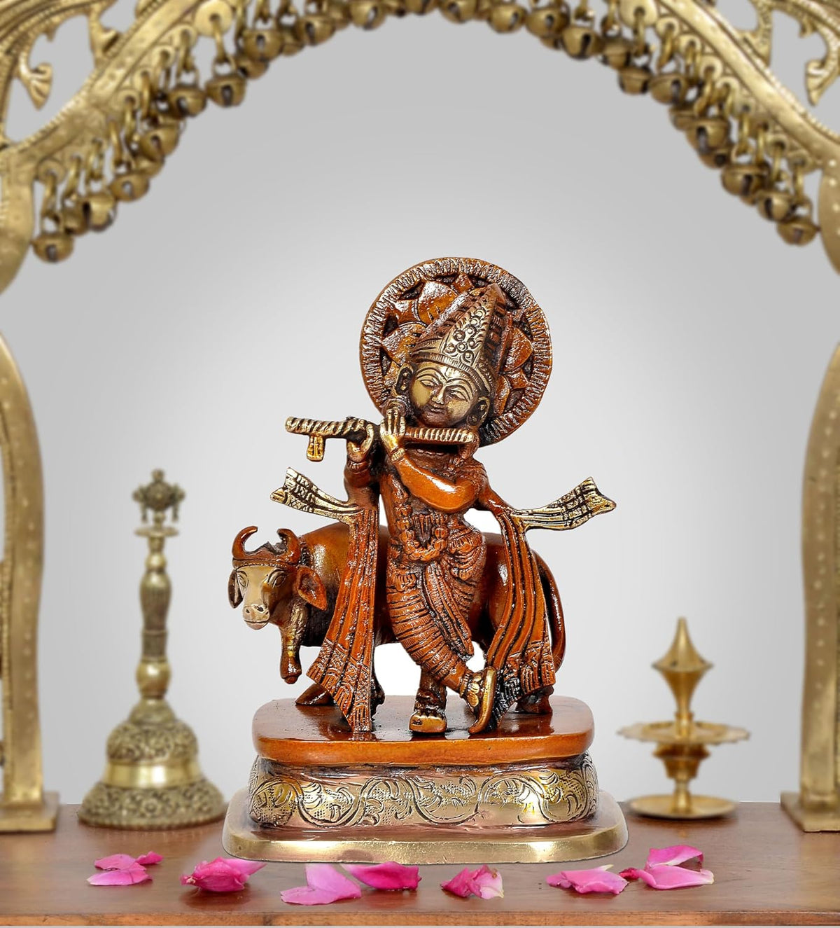 Brass Lord Krishna figurine with cow, standing on ornate round base