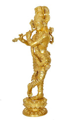 Brass Krishna flute figurine, side view full body with ornate clothing and base