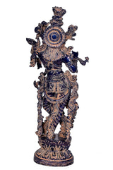 Krishna idol figurine with circular chest motif, blue accents, ornate brass detailing