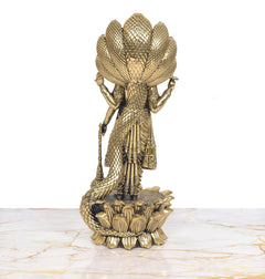 Back view of Vishnu statue on lotus with Sheshnag serpent, ornate bronze-gold finish