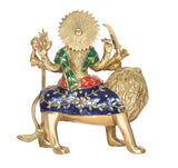 Durga Maa idol from side view on lion, golden sunburst crown, blue and red drape