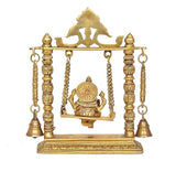 Brass swing idol with seated Ganesha, circular ornament on back panel and hanging bells