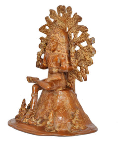 Brass Dakshinamurti Shiva statue from side angle, seated with patterned base