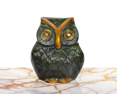 Brass owl tabletop showpiece, front view with embossed feathers and golden eyes