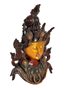 Brass Tara wall hanging mask, golden face with raised arms and swirling hair