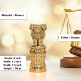Bronze-toned Ashoka Stambh with lion top and ribbed base, height 4 inch.