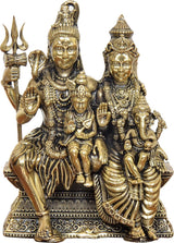 Brass Shiva family idol close-up: Shiva with trident and family figures, detailed jewelry