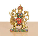 Durga Maa brass idol on lion base, red-green attire with jeweled multicolor accents