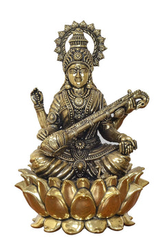 Brass Maa Saraswati statue front view, ornate crown and veena in lap