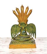Brass naga kanya statue, back view: cobra hood and wing-like fans on green base