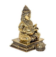 Kuber idol statue angled view, bronze-gold finish, detailed necklaces and ornaments