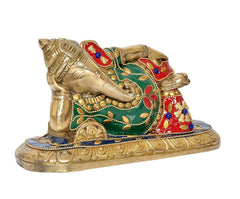 Angled brass reclining Ganesha figurine with green and red painted ornaments