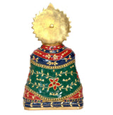 Brass Khatu Shyam ji idol, back view with gold halo and patterned red/blue/green dress