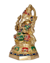 Brass Ganesha idol side view with ornate crown, multicolor robe, and patterned base
