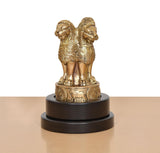 Brass Ashoka figurine rear view on revolving dark base with raised back detailing